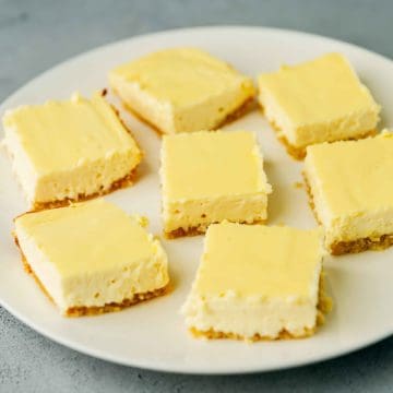 cheesecake bars on a white plate