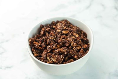 chocolate granola in a white bowl