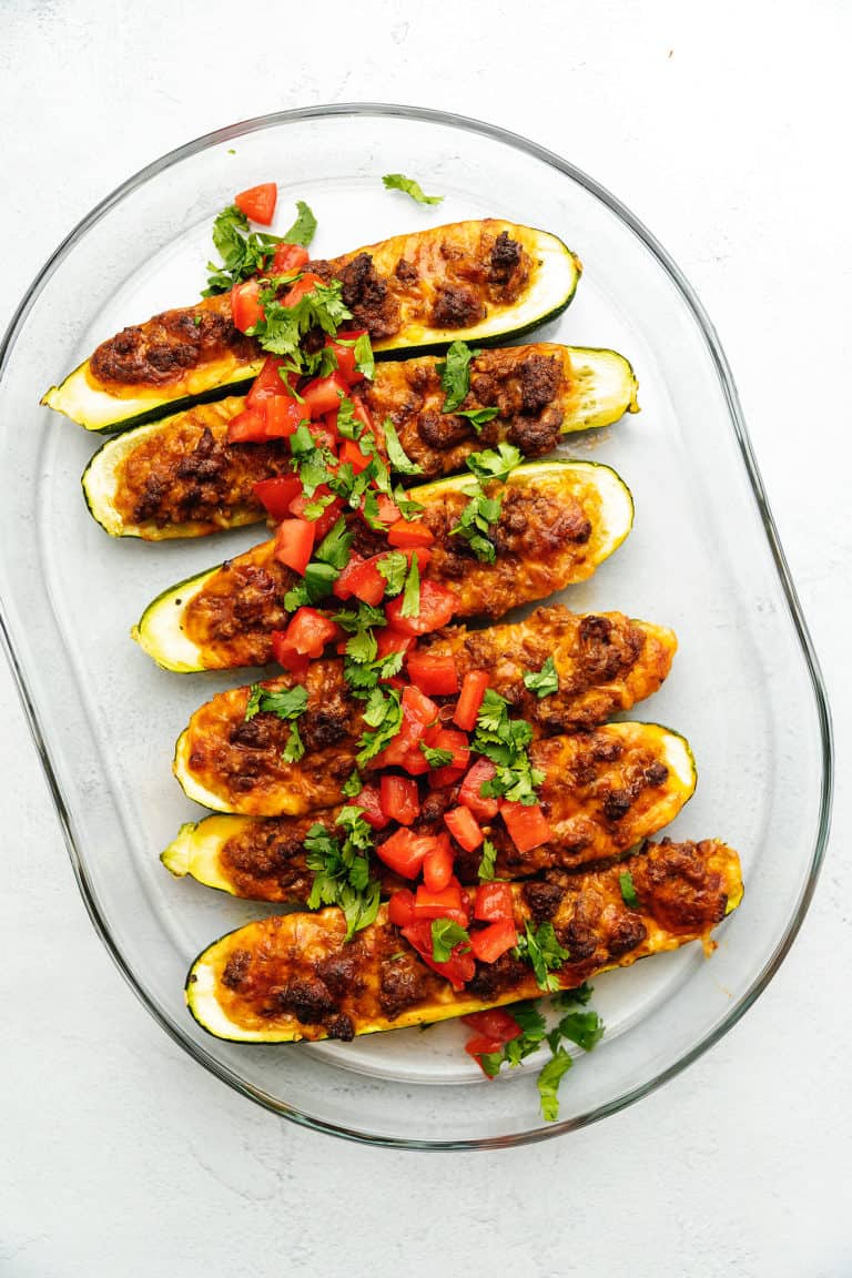 enchilada zucchini boats on a glass plate