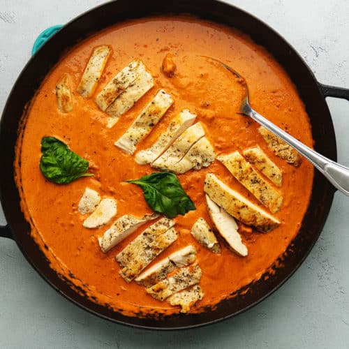 vodka sauce with chicken in a black skillet