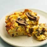 a piece or breakfast strata on a plate