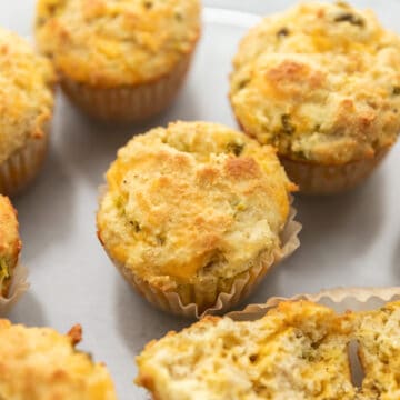 a bunch of jalapeño cheddar muffins on a plate