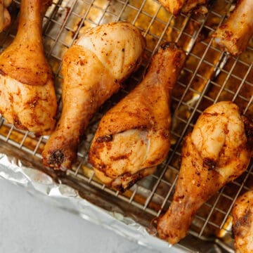 baked chicken legs on a sheet tray