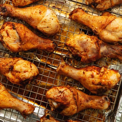 baked crispy chicken legs on a wire rack