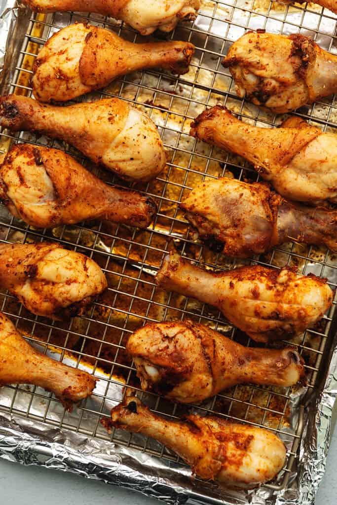 baked crispy chicken legs on a wire rack