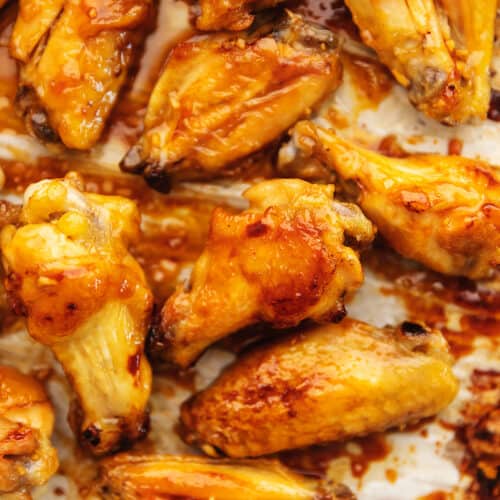 honey garlic chicken wings on a sheet tray