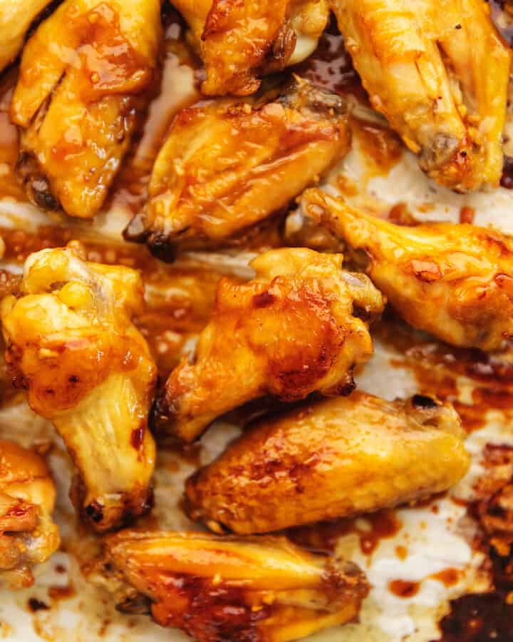 honey garlic chicken wings on a sheet tray