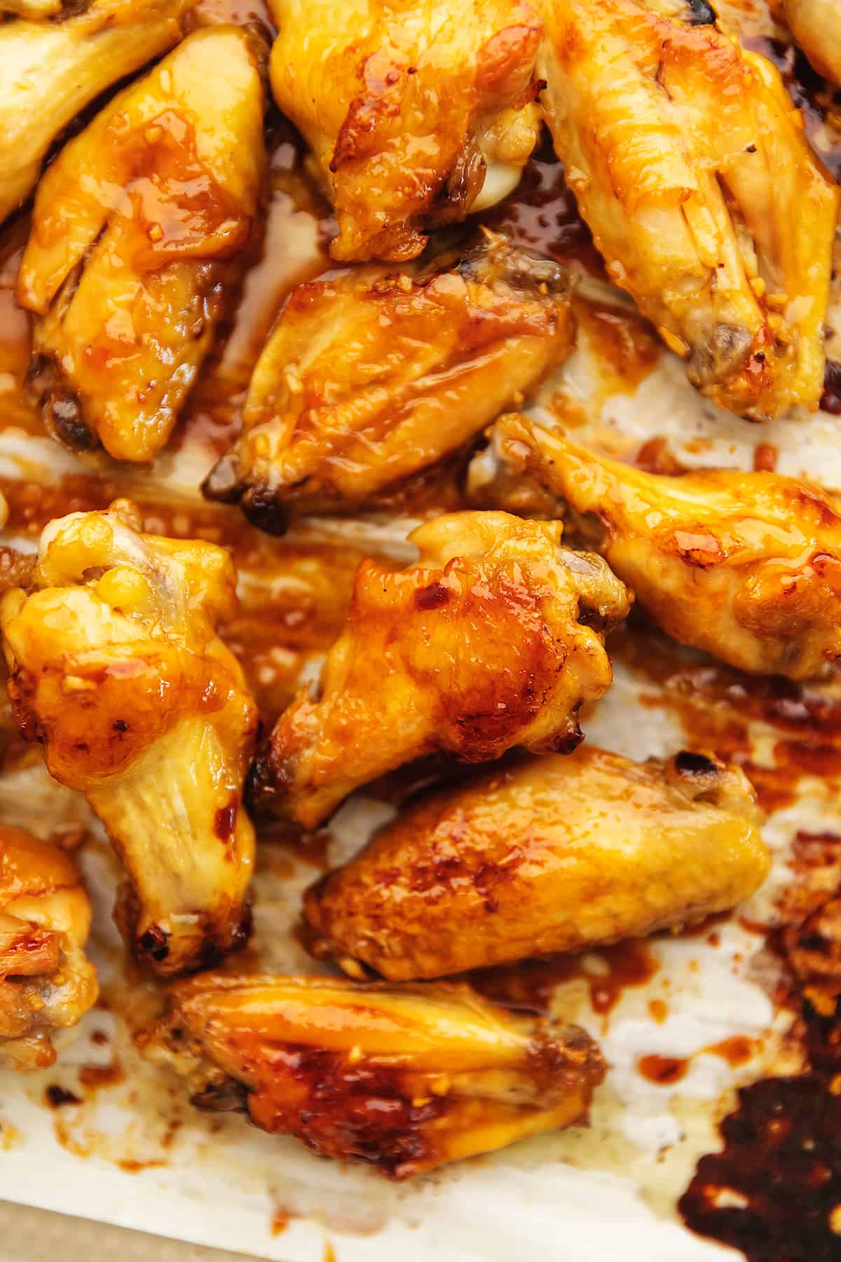 honey garlic chicken wings on a sheet tray