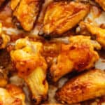 a bunch of sticky chicken wings