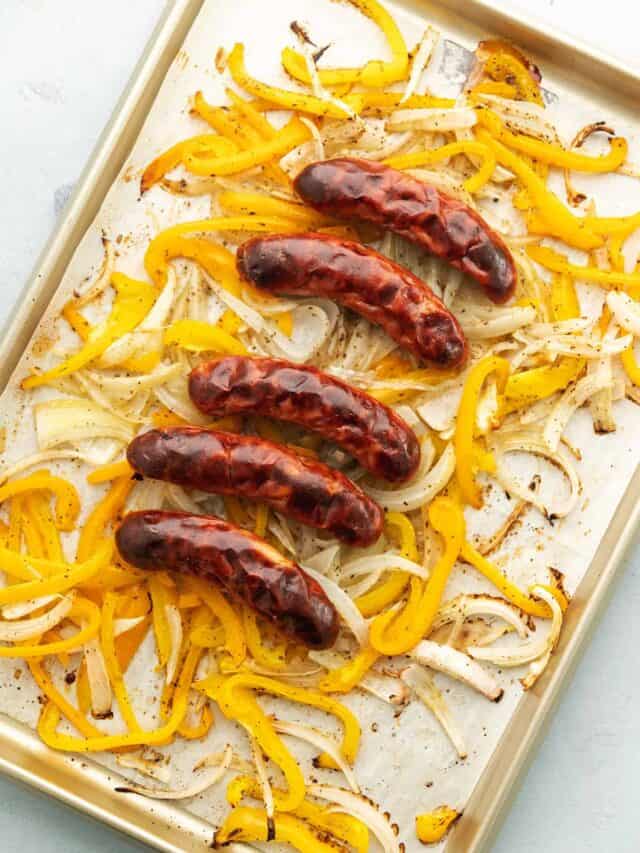 sausage and peppers on a sheet tray