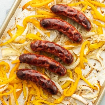 chicken sausage roasted on a sheet pan with peppers and onions