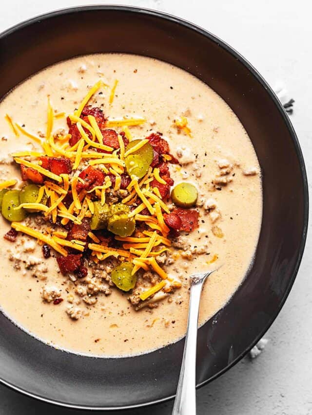 keto cheeseburger soup topped with bacon and pickles