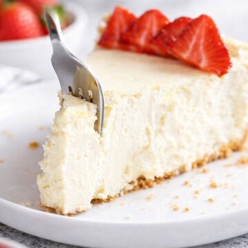 A slice of keto cheesecake on a white plate