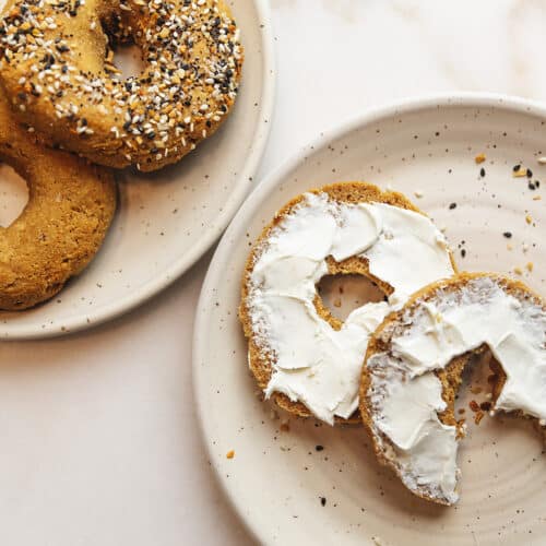 keto bagels on plates with cream cheese
