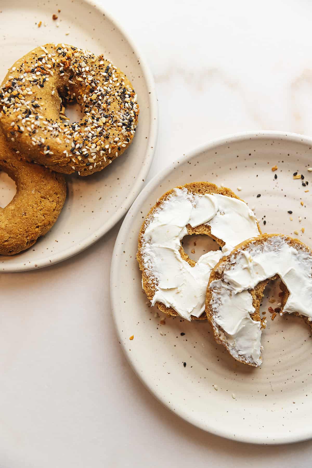 keto bagels on plates with cream cheese