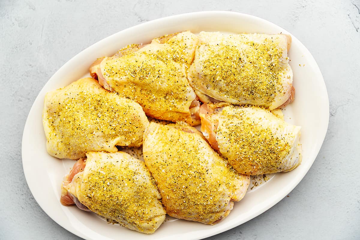 chicken thighs seasoned on a platter