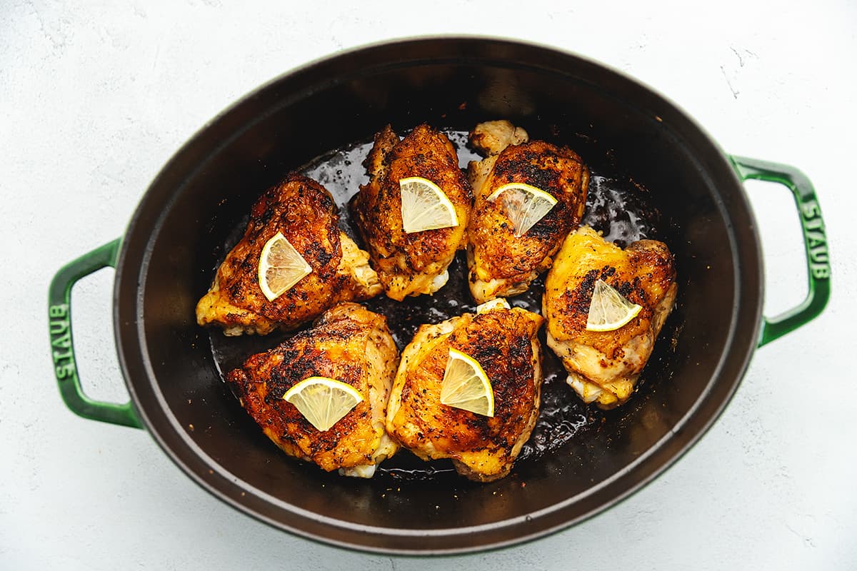 chicken thighs with lemon pepper in a dutch oven