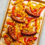 andouille sausage and peppers on a sheet tray