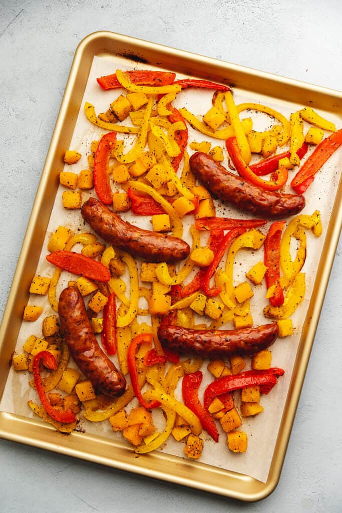 andouille sausage and peppers on a sheet tray