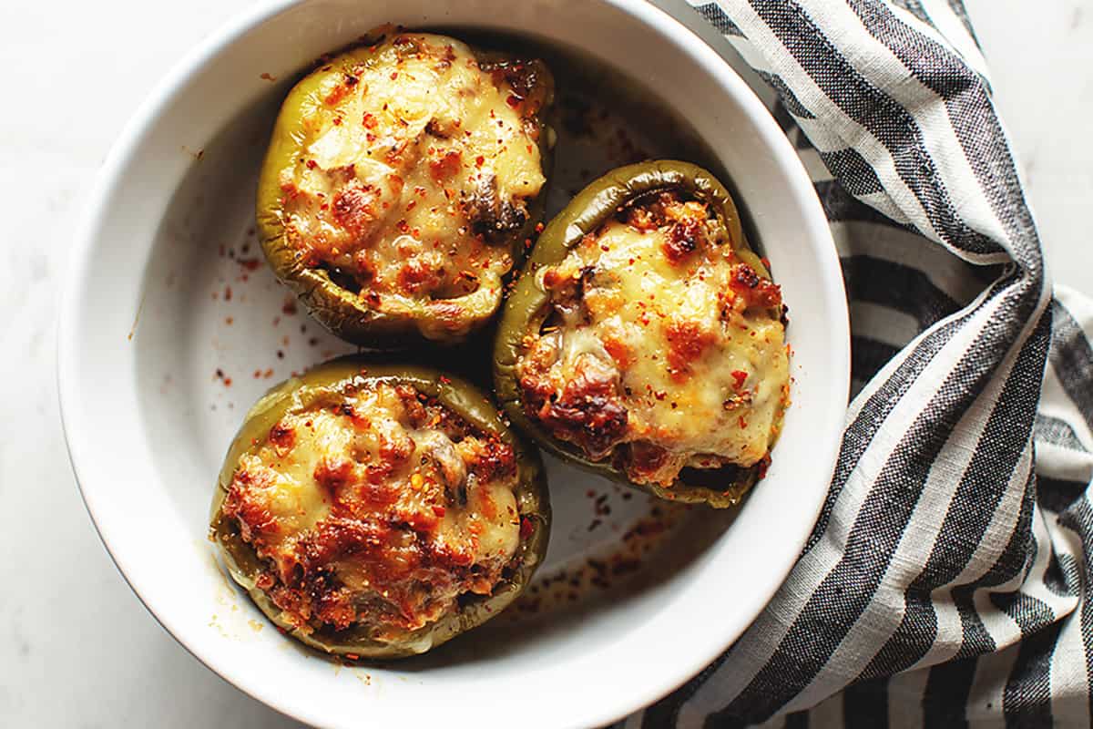 keto stuffed peppers in a white casserole dish
