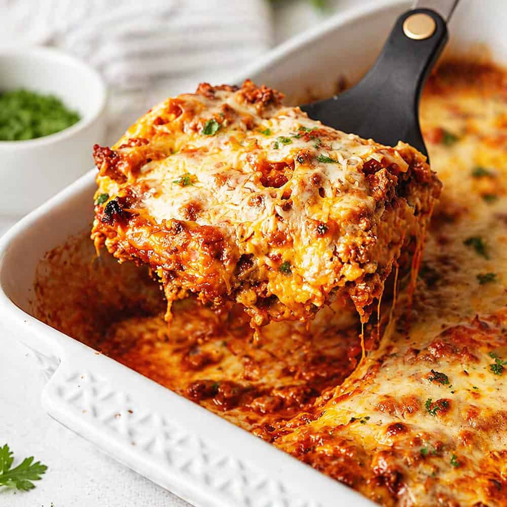 a serving of keto lasagna being served with a spatula