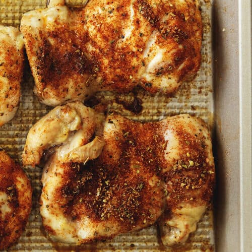 baked chicken thighs on a sheet tray