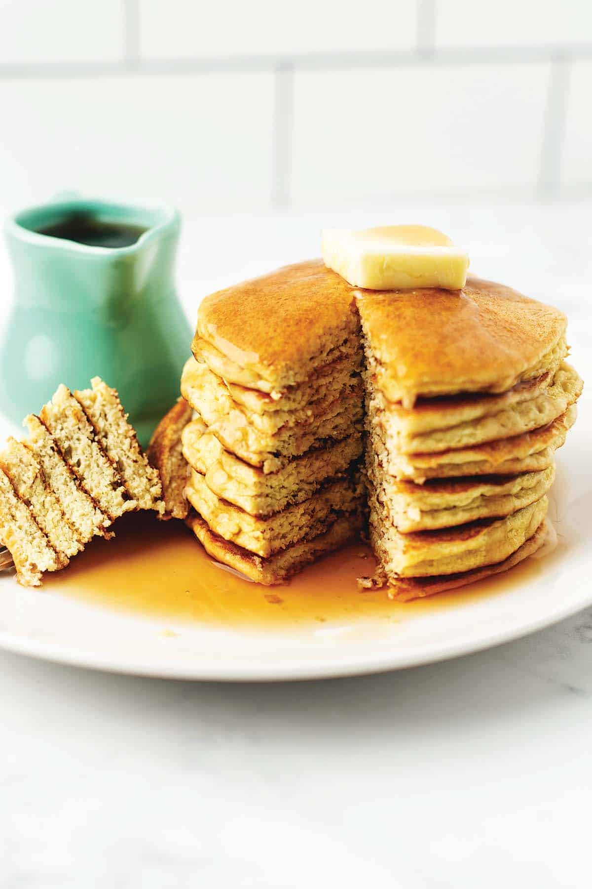 A stack of low carb pancakes on a white plate