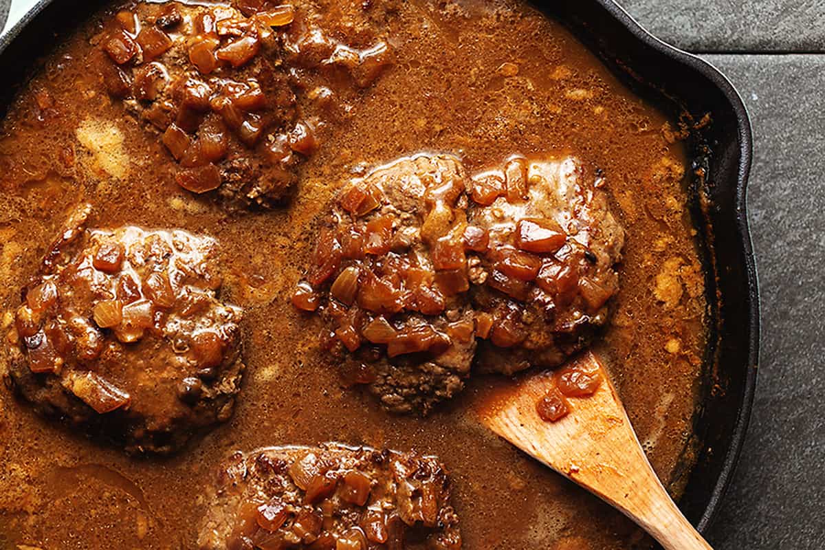 cubed steak and gravy in a skillet