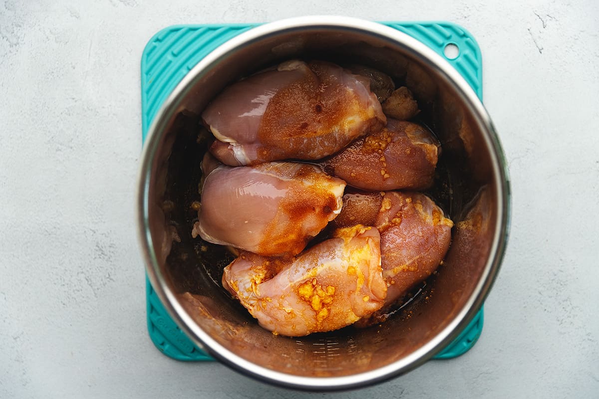 chicken thighs with a sauce in an instant pot