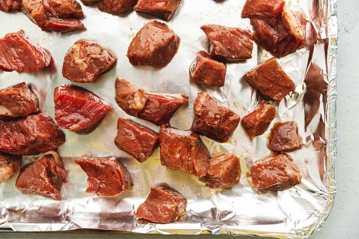 steak bites on an air fryer tray