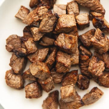 air fryer steak bites on a white plate