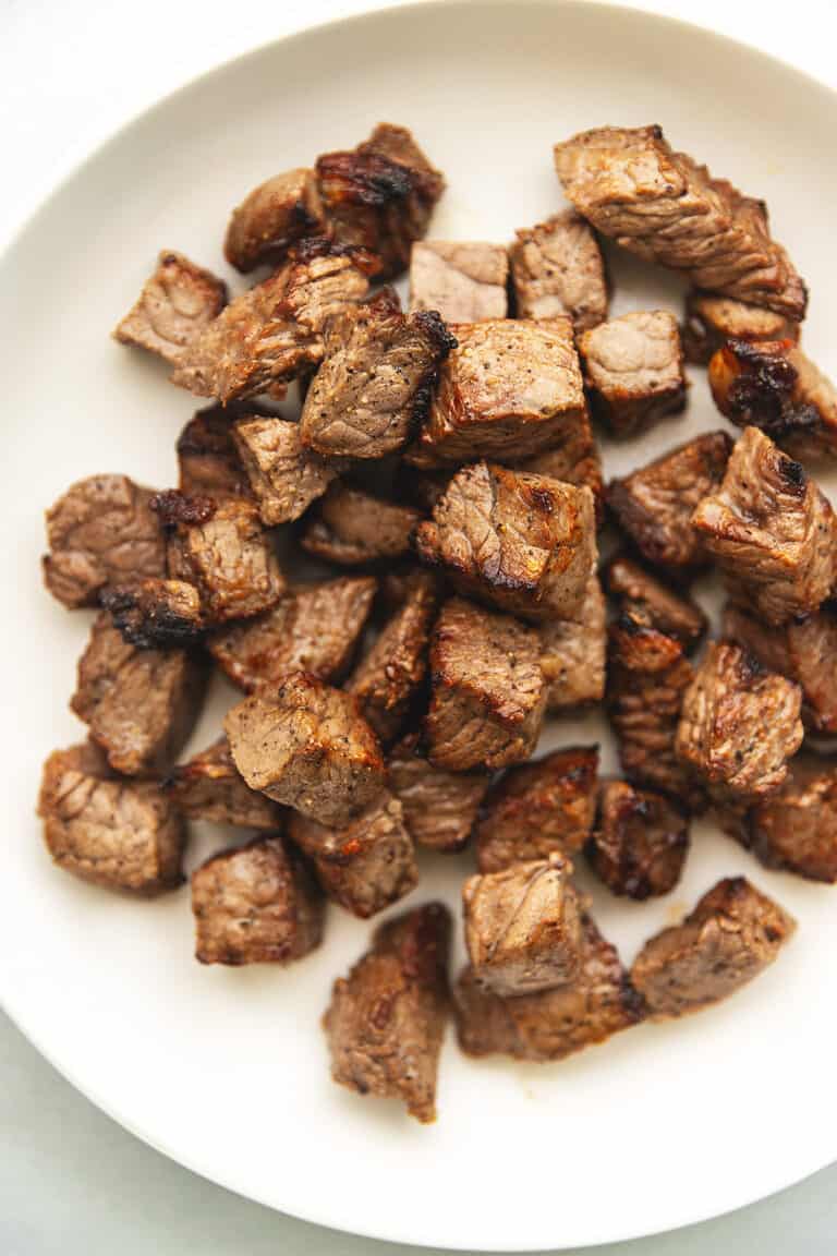 air fryer steak bites on a white plate