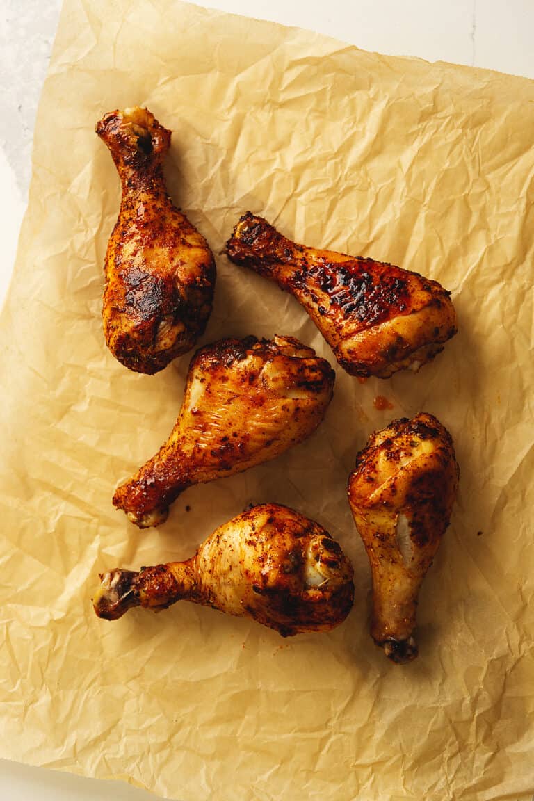 crispy chicken legs on a piece of parchment