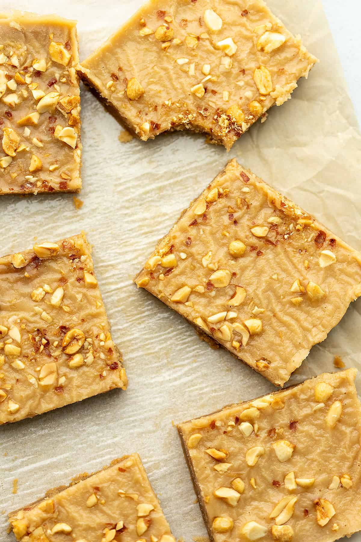 keto peanut butter bars on a sheet of parchment paper