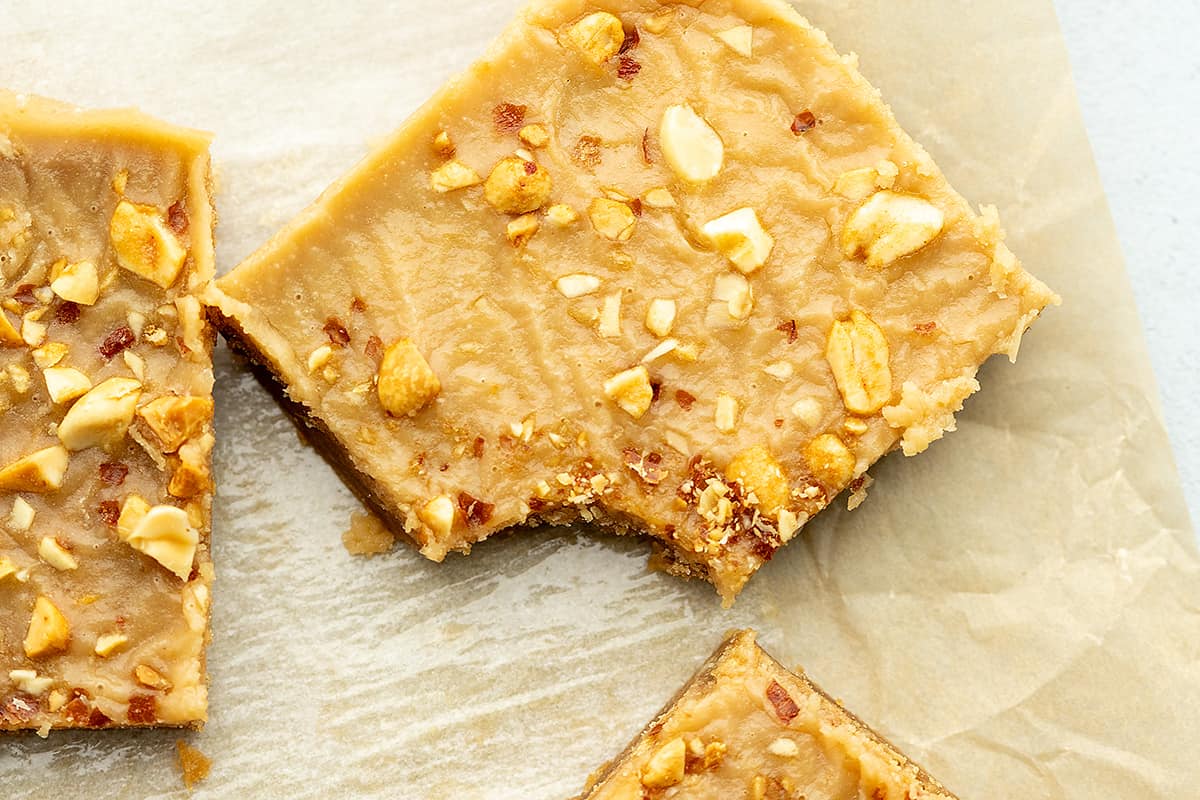 a bite taken out of a keto peanut butter bar