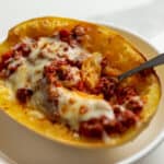 an Italian stuffed spaghetti squash boat