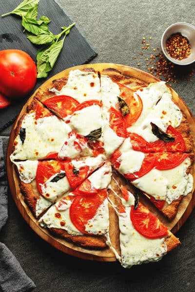 a pizza with tomatoes and mozzarella