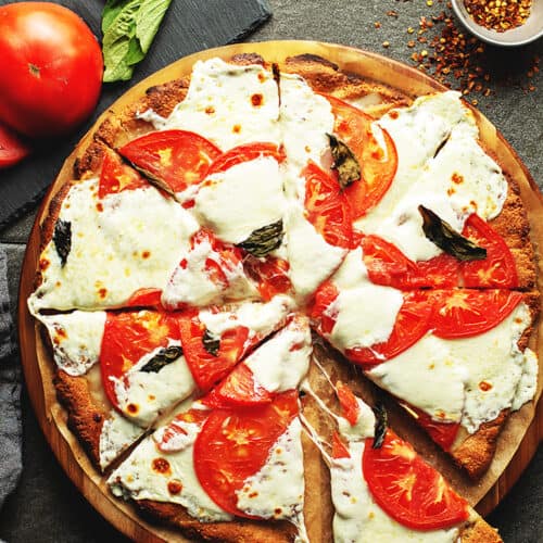a pizza with tomatoes and mozzarella