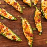 air fryer jalapeno poppers on a wooden cutting board