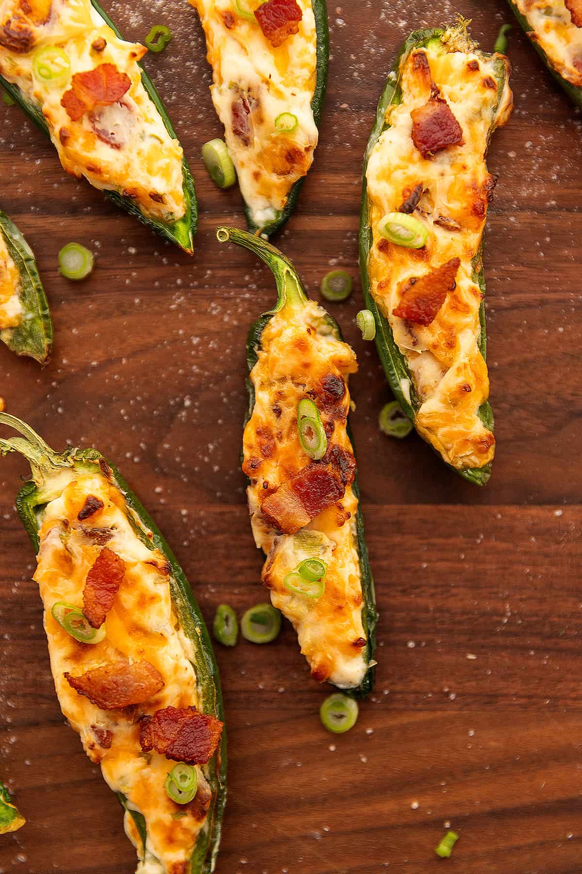 jalapeno poppers on a wooden cutting board