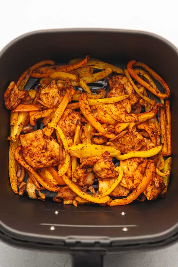 cooked chicken fajitas in the air fryer basket