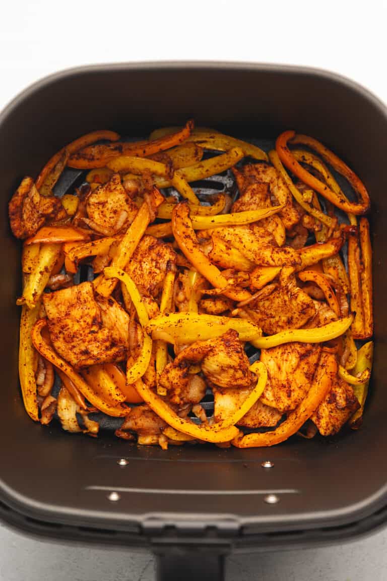 cooked chicken fajitas in the air fryer basket