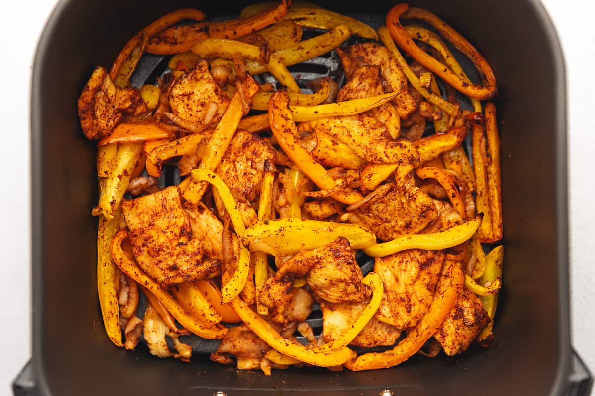 cooked chicken fajitas in the air fryer basket