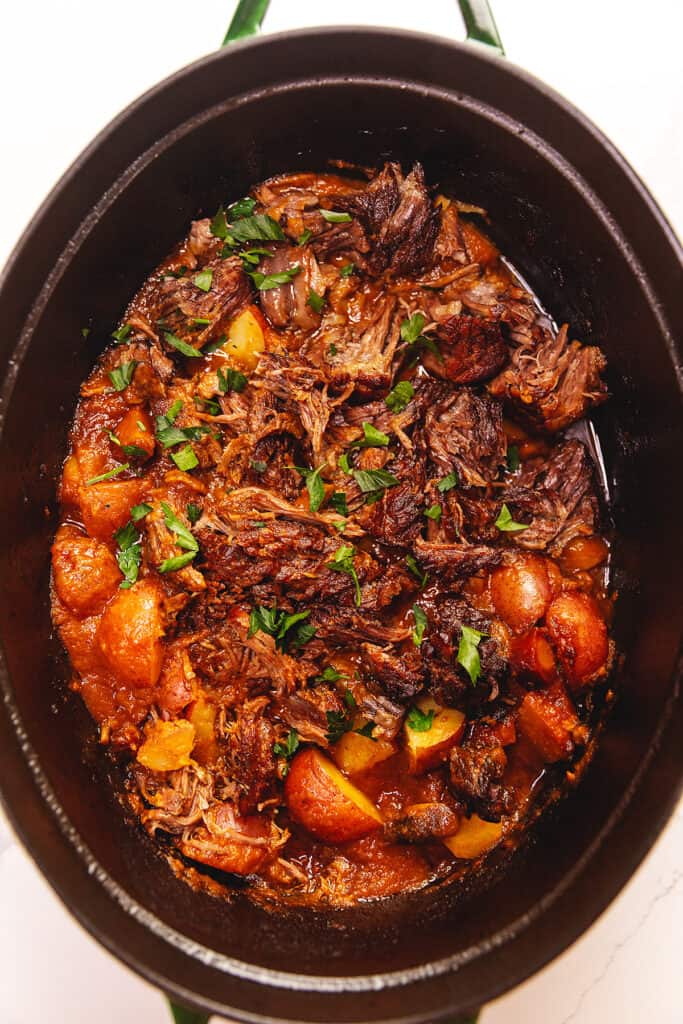 pot roast with potatoes in a dutch oven