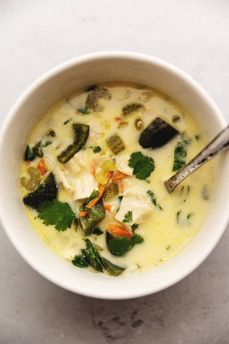 poblano chicken soup in a white bowl