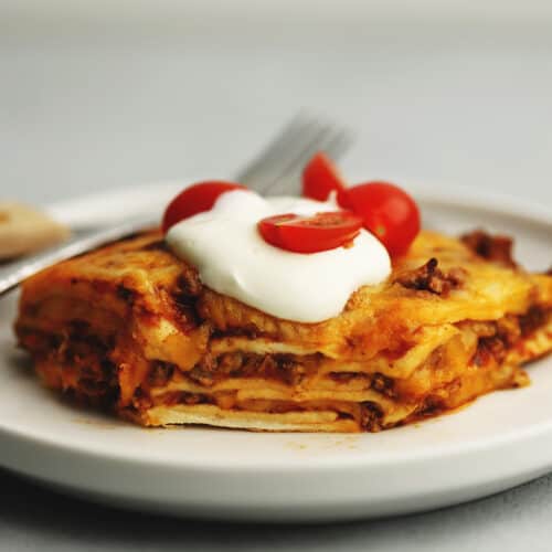 mexican lasagna on a white plate