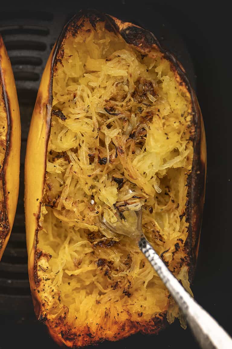 cooked spaghetti squash in an air fryer basket