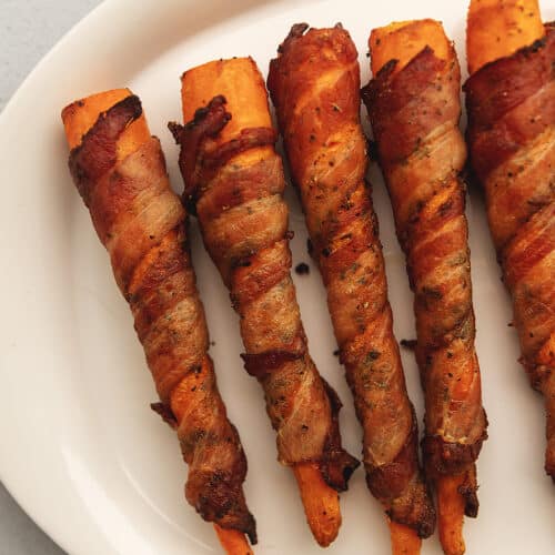 bacon wrapped carrots on a platter
