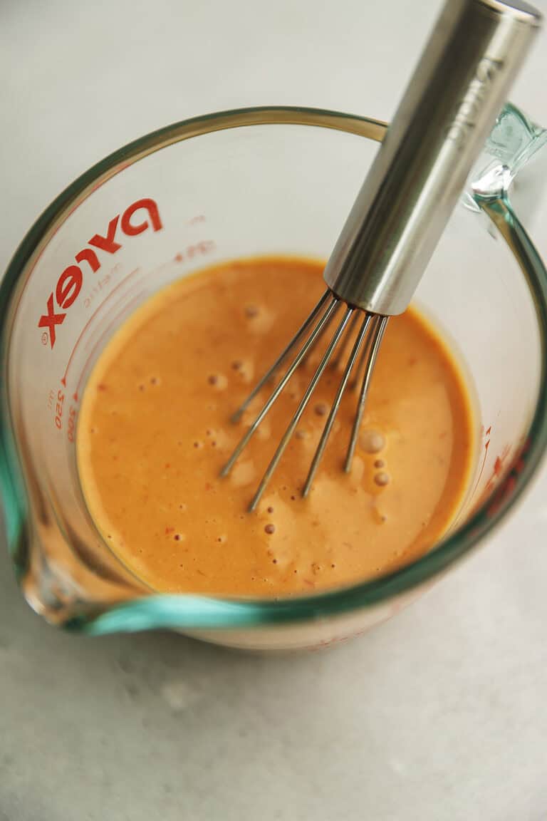 bang bang sauce in a measuring cup