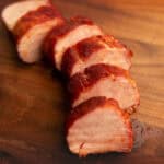 sliced pork tenderloin on a cutting board